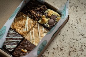 Mixed Chocolate Brownie Box on a marbled background
