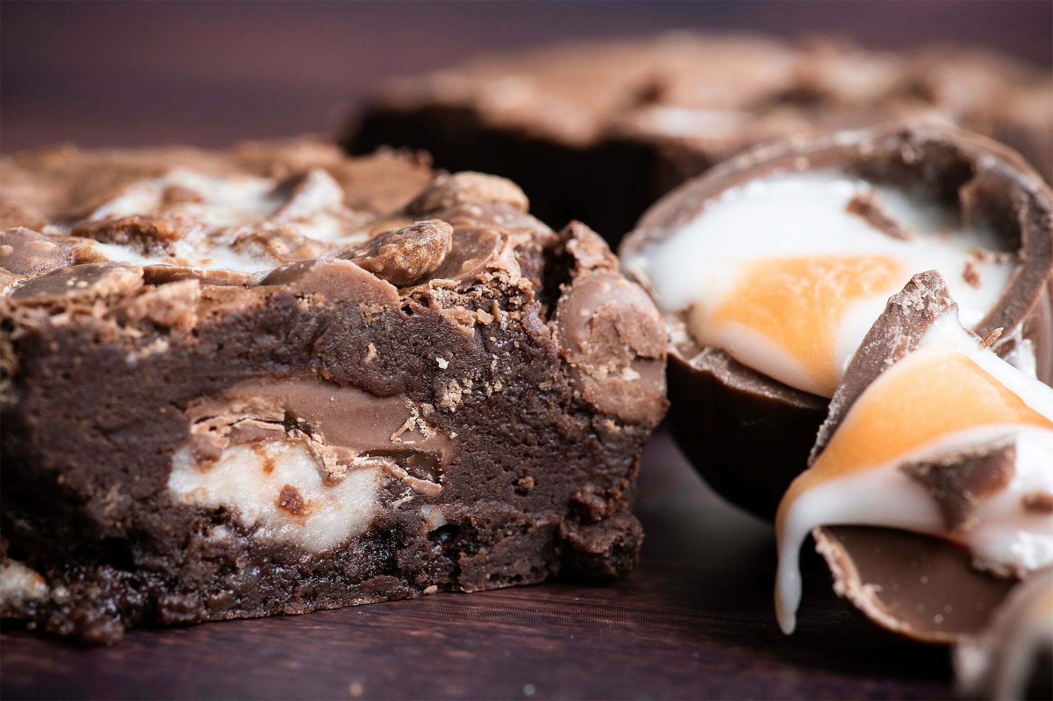 Our Creme Egg Brownie is part of our Easter brownie gifting box. The creme egg brownie is on the left and the Creme Eggs are on the right of the image, cut in two so you can see the egg yolk and egg white fondant icing.