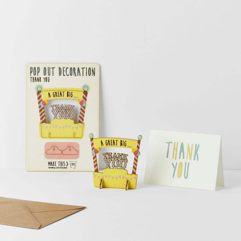 Thank you card with an envelope and keep sake on a white background