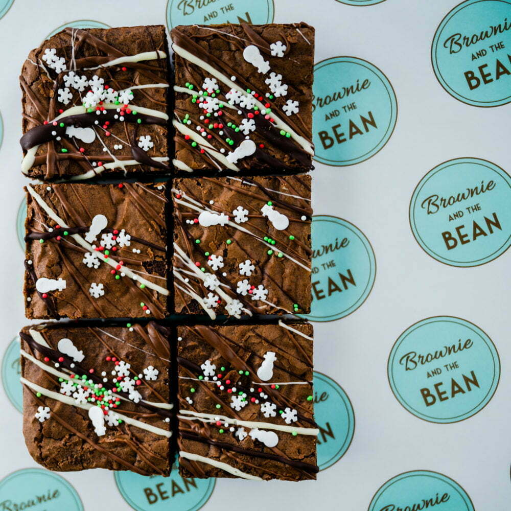 Christmas Triple Chocolate Brownie on a printed greaseproof background