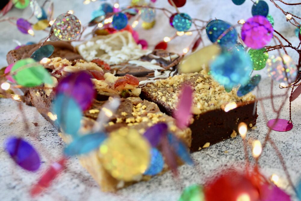 Christmas Brownies with tinsel and lights on a white background