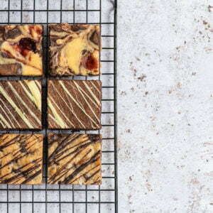 Last minute Mother's Day gifts on a baking grid. There's a marbled background and 6 brownies.