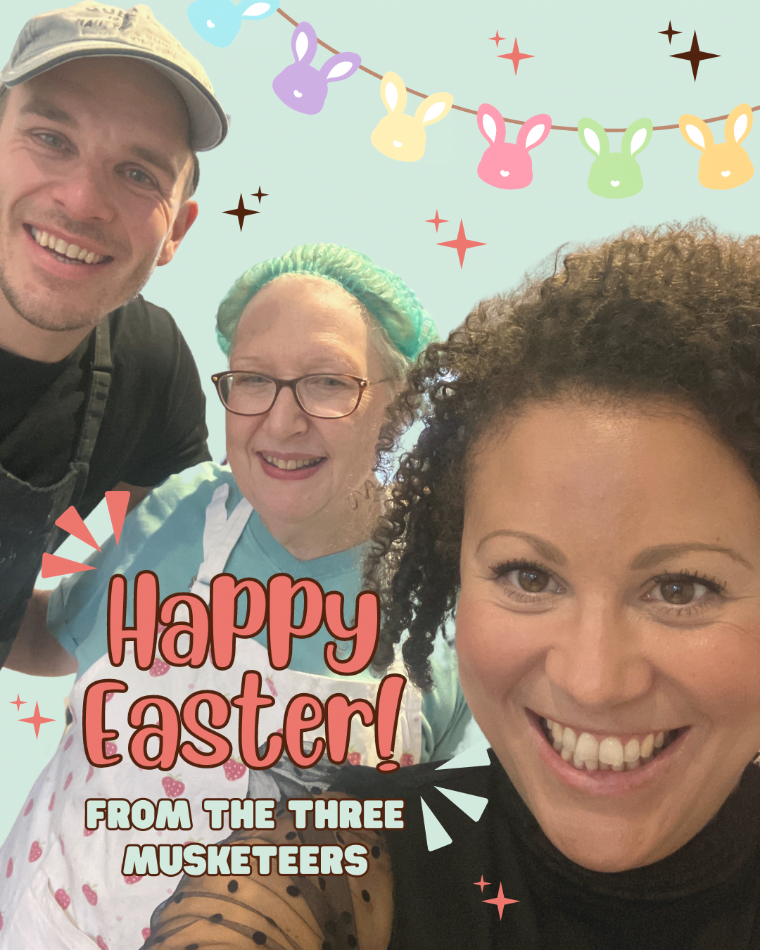 The Brownie and the Bean team (Bean Daddy, Super Sous and Mama Bean) are all smiling in a photo that has a graphic reading "Happy Easter! From the Three Musketeers". All three of them are smiling and there is Easter Bunting in the background with pastel coloured bunnies dangling from the top of the image.