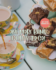 Text reads: "One more bank holiday to go". In the photo there is an afternoon tea laid out. There are two yellow cups and saucers on a pale mint green picnic bench. Tea is being poured into one of the cups. there is a teaspoon on a saucer. To the right of the teacups is a 3 tiered cake stand in pale mint green and gold. There are a variety of brownies and blondies on the cake tier.